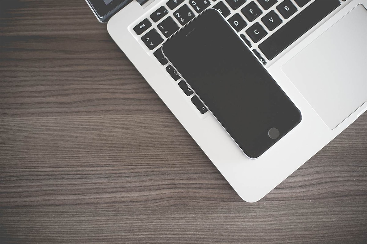 iPhone Lying on MacBook Keyboard